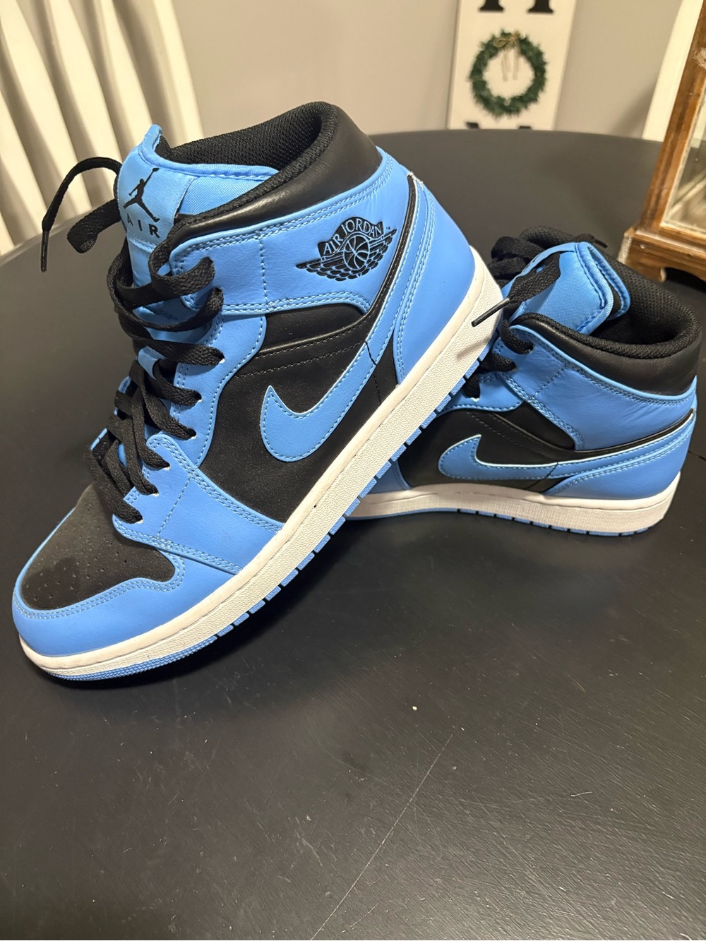 Jordan Air 1 Mid Sneakers in Black and University Blue